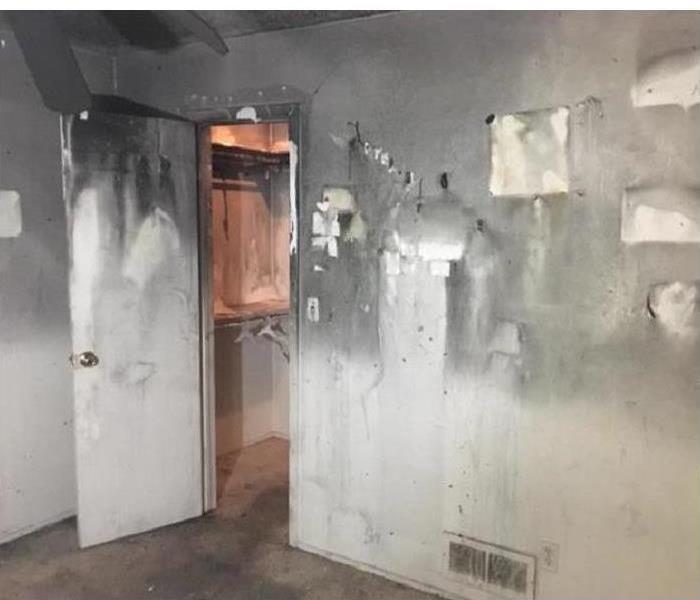 walls of a home covered with soot and smoke damage.