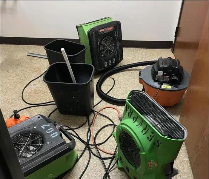 Three air movers (fans) two waste bins 